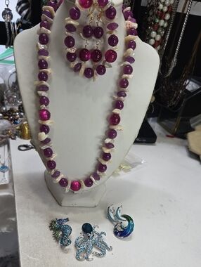 Bundle of purple necklace earrings bracelet set and 3 ocean rocches